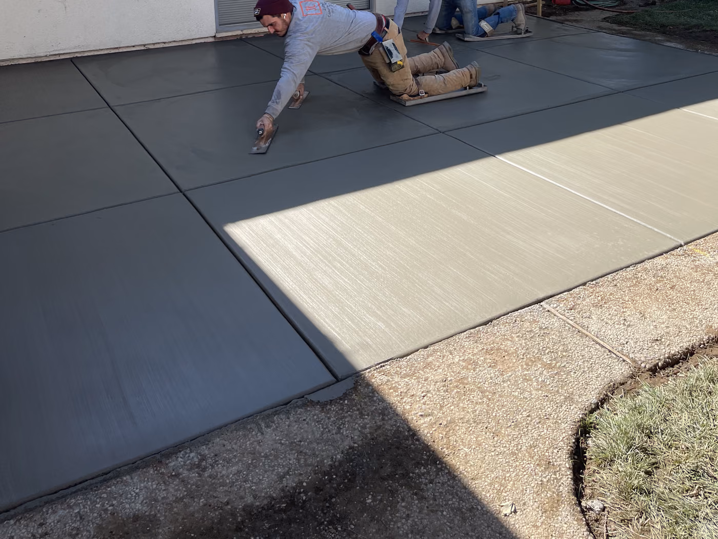 Finished concrete patio poured to replace a brick one