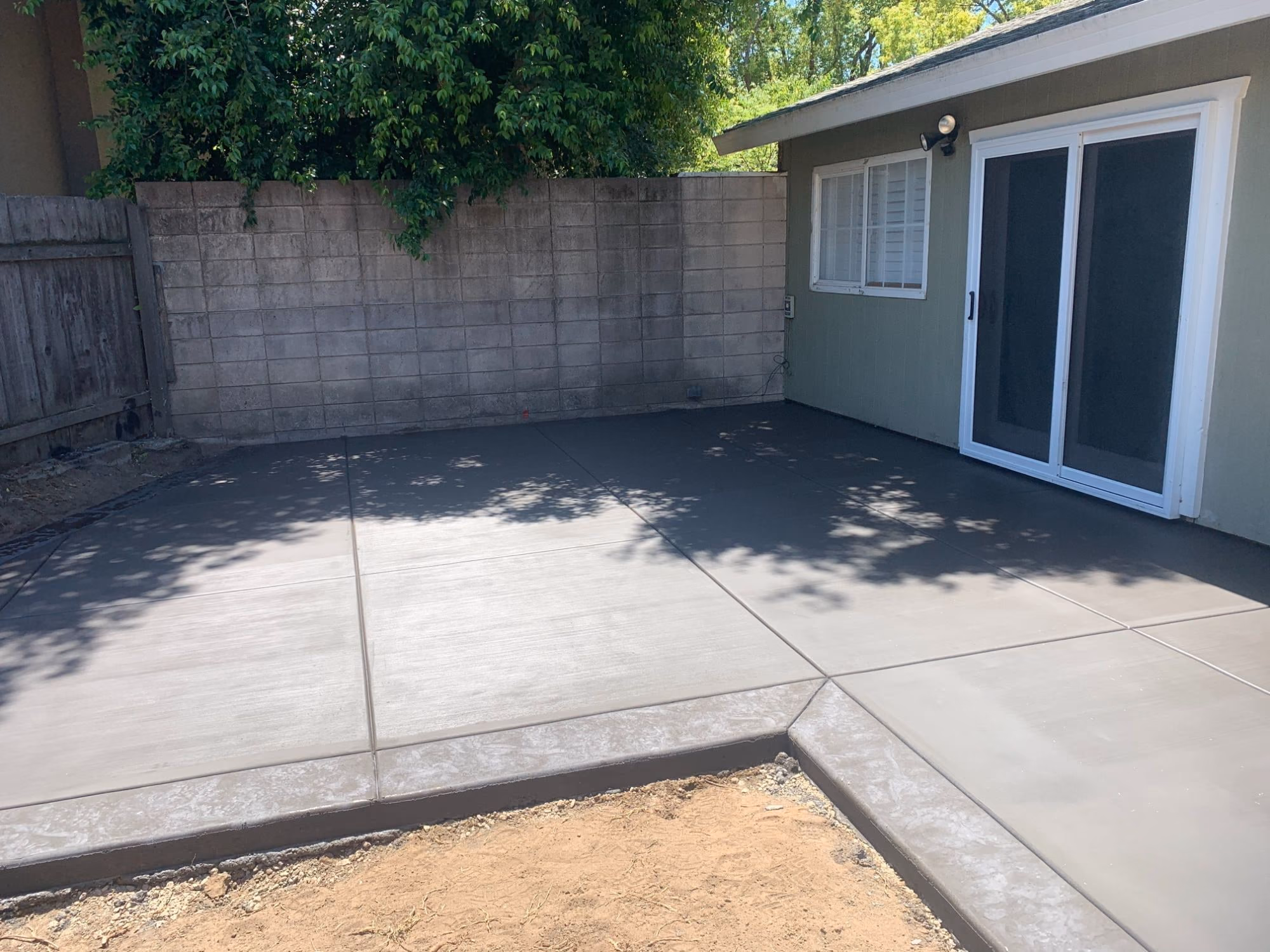 Broom-finished concrete patio in a Sacramento back yard