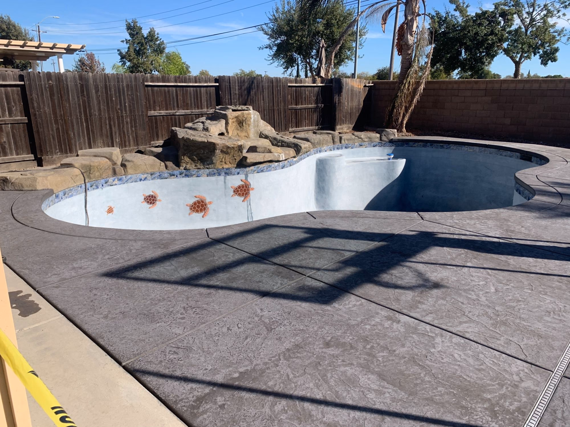 Textured concrete pool deck completed in Sacramento, California